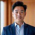 Professional photo of Jayden Lee, a financial coach specializing in holistic financial planning for career transitions.